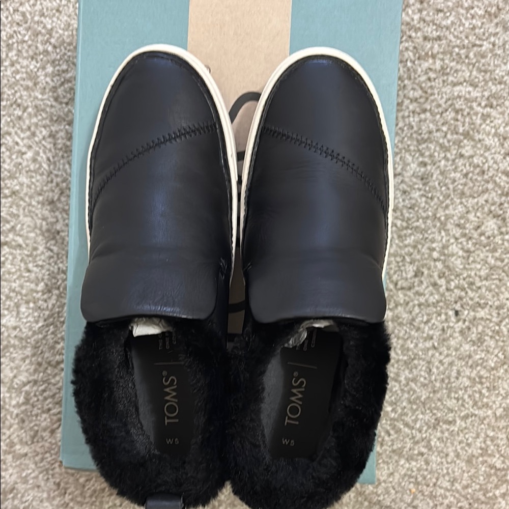 TOMS Black Leather Slip-Ons with Fur Lining